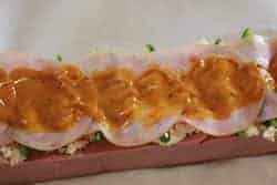 Jeff's mustard sauce onto smoked ham