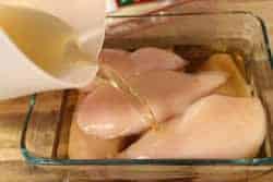 Pour brine over chicken breasts