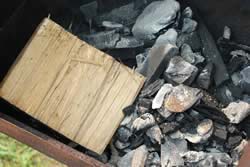 2 chimneys of lump charcoal into firebox
