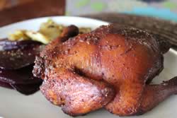 Plated cornish hen with sides