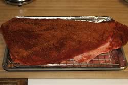 Brisket rubbed and laying on bradley rack