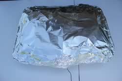 brisket in pan covered with foil