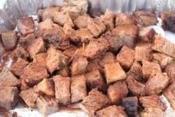 Rub sprinkled on brisket cubes