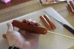 Skewer through center of hotdog