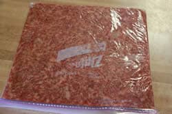 Roll sausage flat inside bag