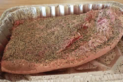 Brisket sprinkled with salt and pepper rub