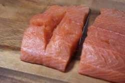 Cut groove into salmon pieces