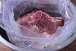 Pork chops into bag for brining