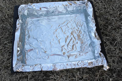 Water pan covered with foil to make cleanup easier