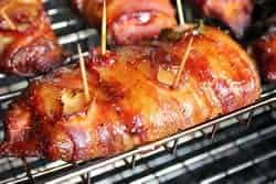 Bacon wrapped chicken breasts in smoker