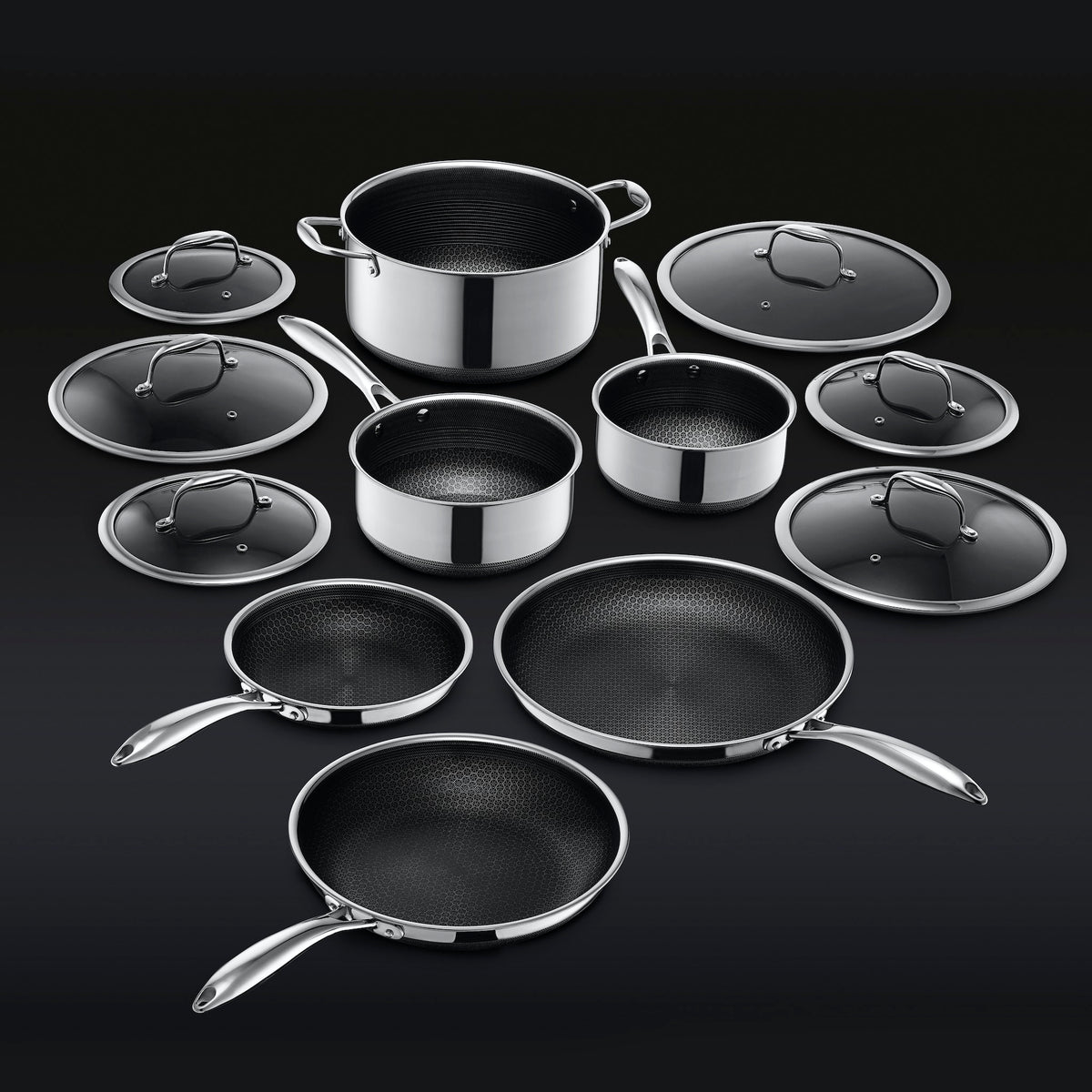Complete HexClad 12-piece cookware set showing three frying pans, three pots and six lids