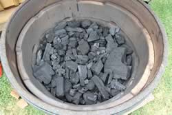 Pour the fire bowl full of lump charcoal