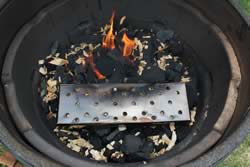 Chip box placed on top of coals