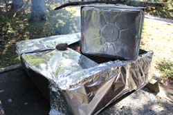 Foil around grill to direct the heat and smoke up through the box