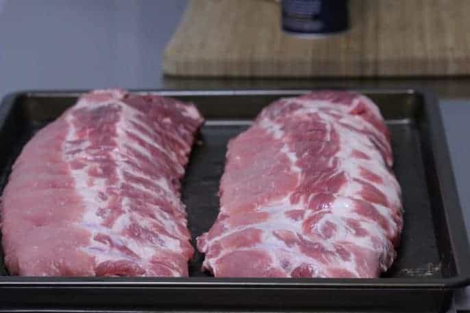 Pork rib laid out in a pan before dry brining them Pork rib laid out in a pan before dry brining them