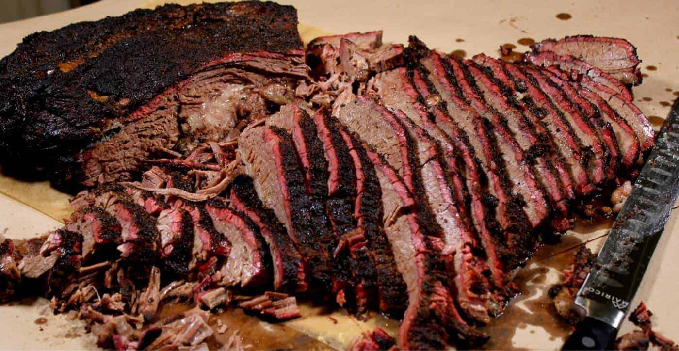 Homemade Smoked Meat On Wooden Cutting Board With Big Knife Stock