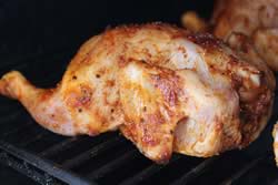 Brined, rubbed birds on smoker grate