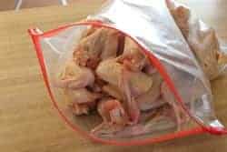 Chicken wings into bag
