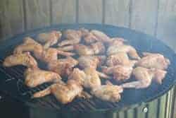 Chicken hot wings on top grate