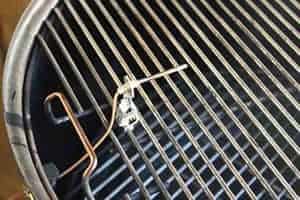 Top grate installed and pit probe through grommet